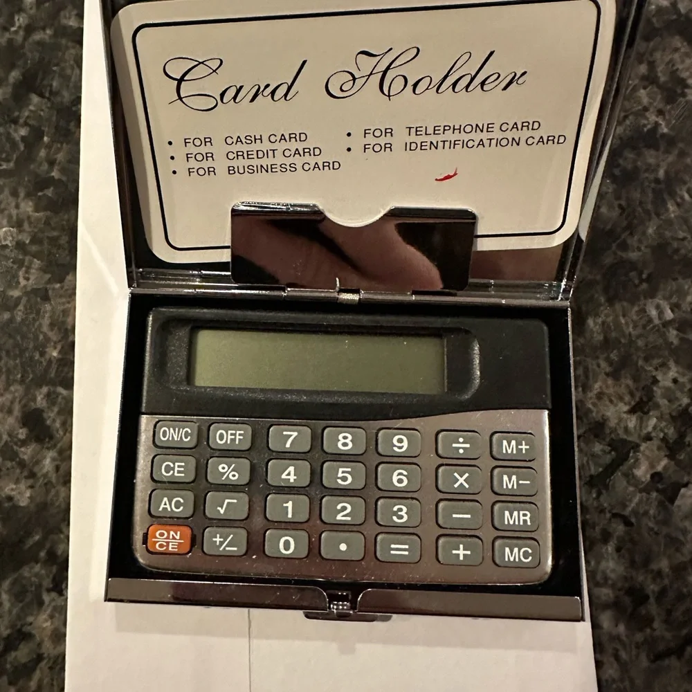 Calculator/card case.  Gently pre-owned.  Note some scratches on back.